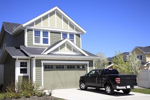 outside of a home with a truck parked in the driveway